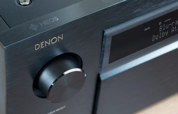 Closeup of Denon AVC-X8500H control and Denon logo