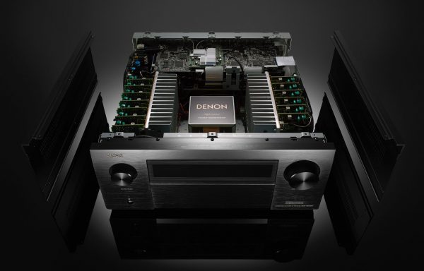 Image of Denon AVC-X8500H with top cover removed showing internal components High current power transformer.