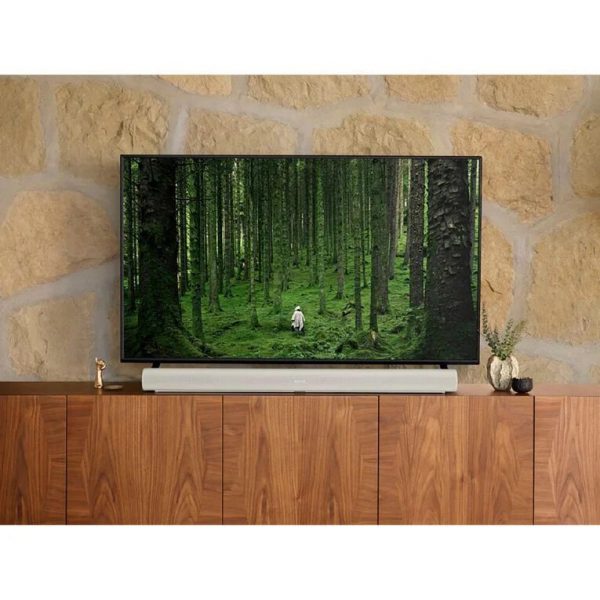 Lifestyle image of White Sonos ARC Premium Smart Soundbar on unit below a TV