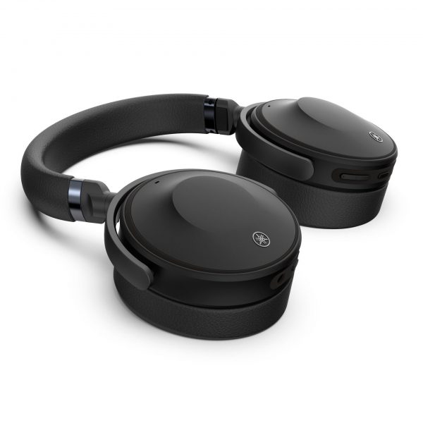 Image of Yamaha YH-E700A Wireless Noise Cancelling Headphones laying flat on bench.
