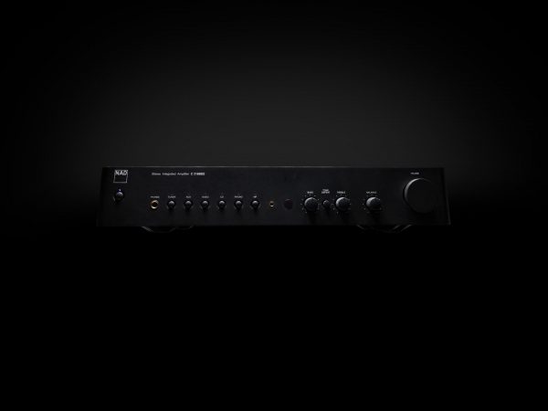 NAD-C 316 BEE black amplifer on black background with light shining from above.