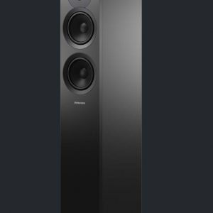 Black Dynaudio Emit 30 on dark background angling away to the left without speaker grill
