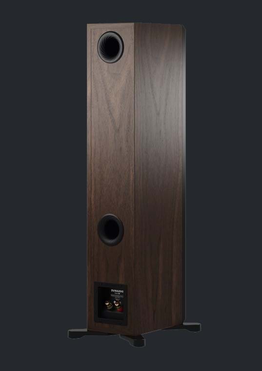 Dynaudio Emit 30 in Walnut facing away from the camera, showing speaker cable binding posts.