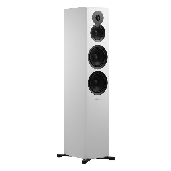 White Dynaudio Emit 50 floostanding speakers angling away to the right with no speaker grill.